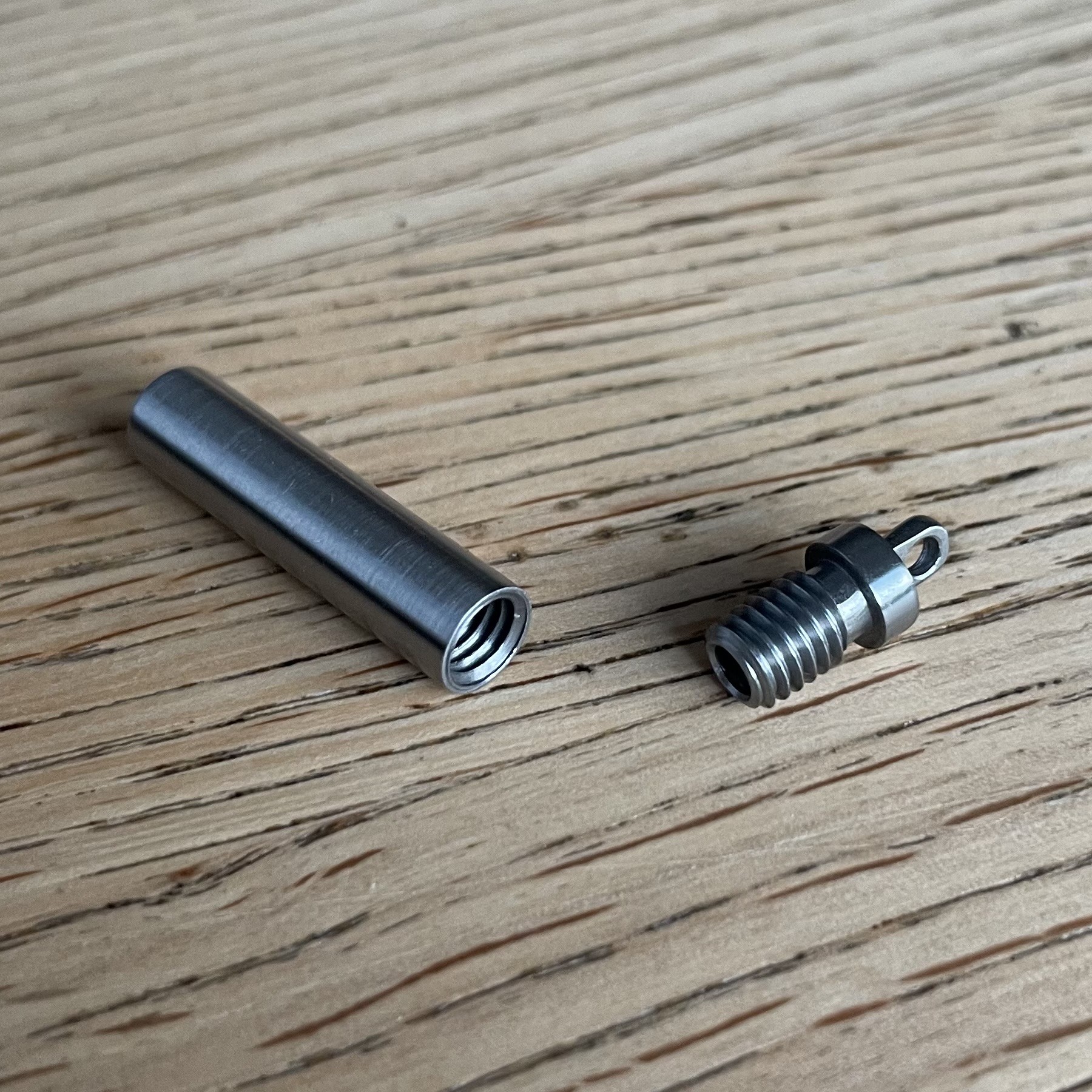the capsule, opened. The cap has an M5 thread