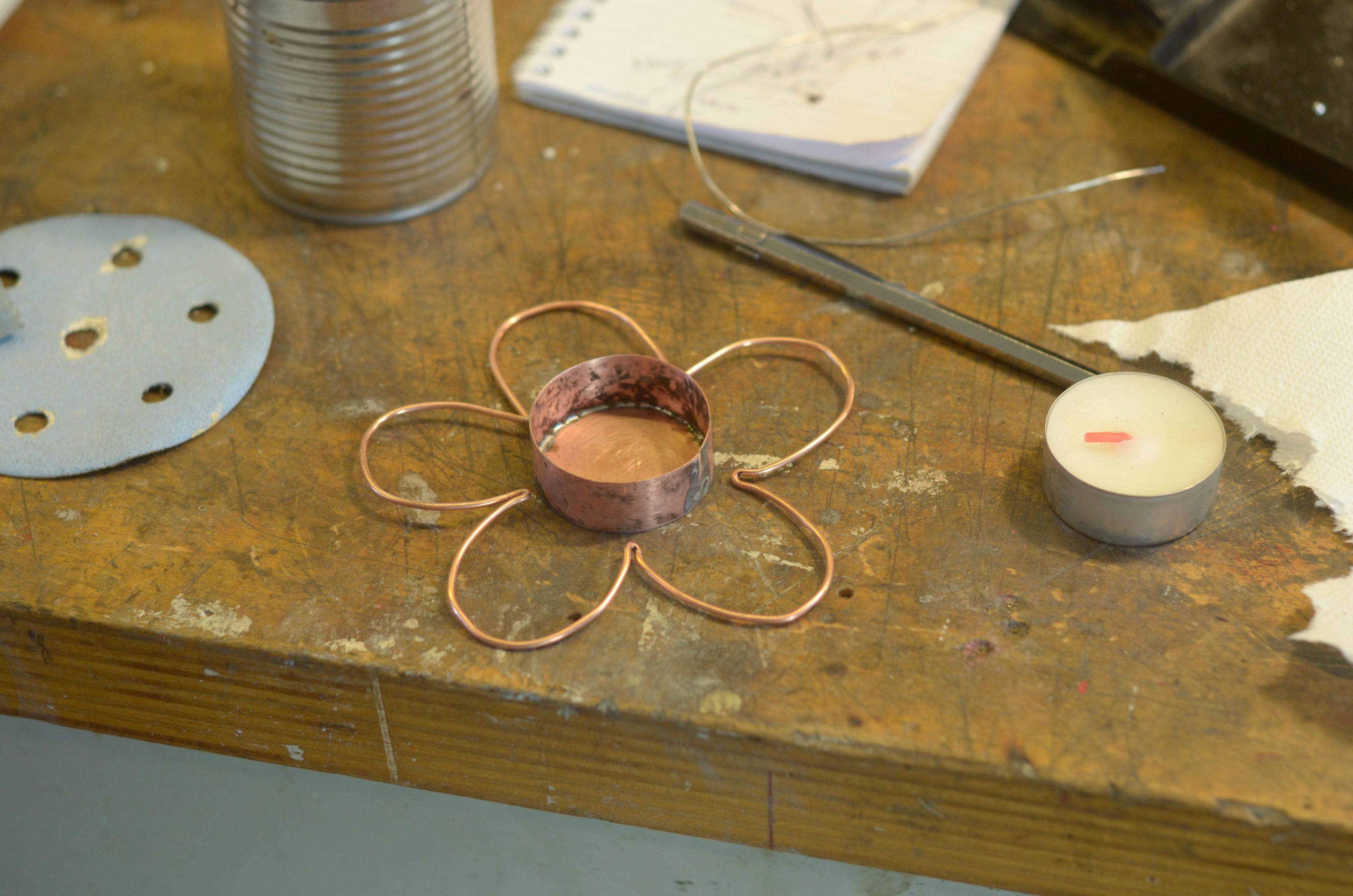 The soldered tub with an earlier shape of the petal crown placed around it.