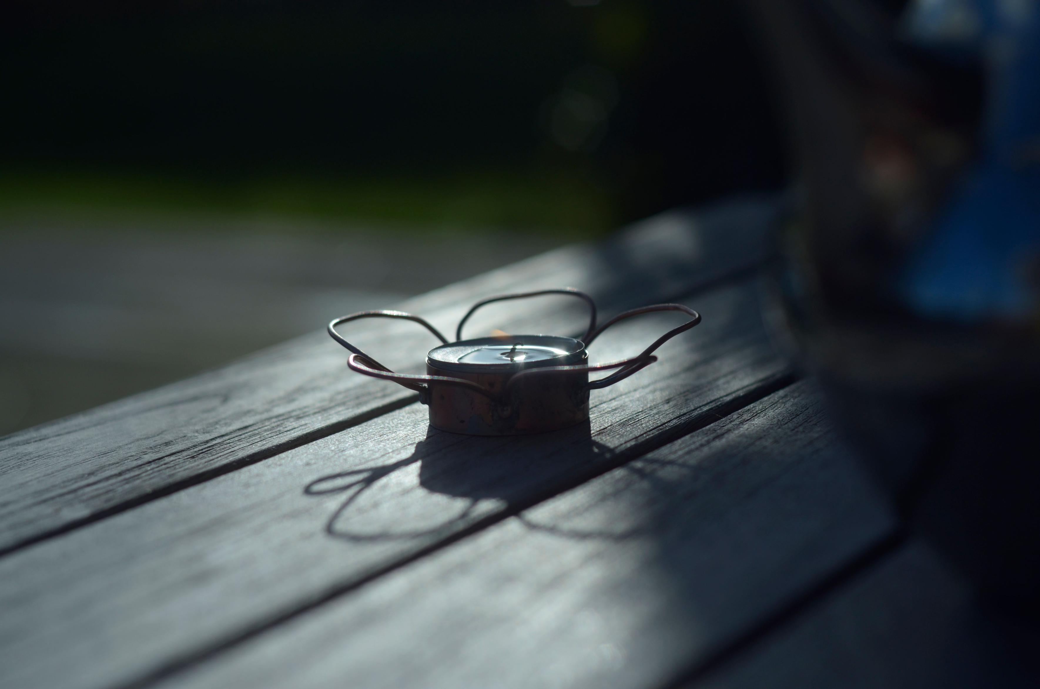 A faint flame can be seen in this shot of the holder up against the light. 
