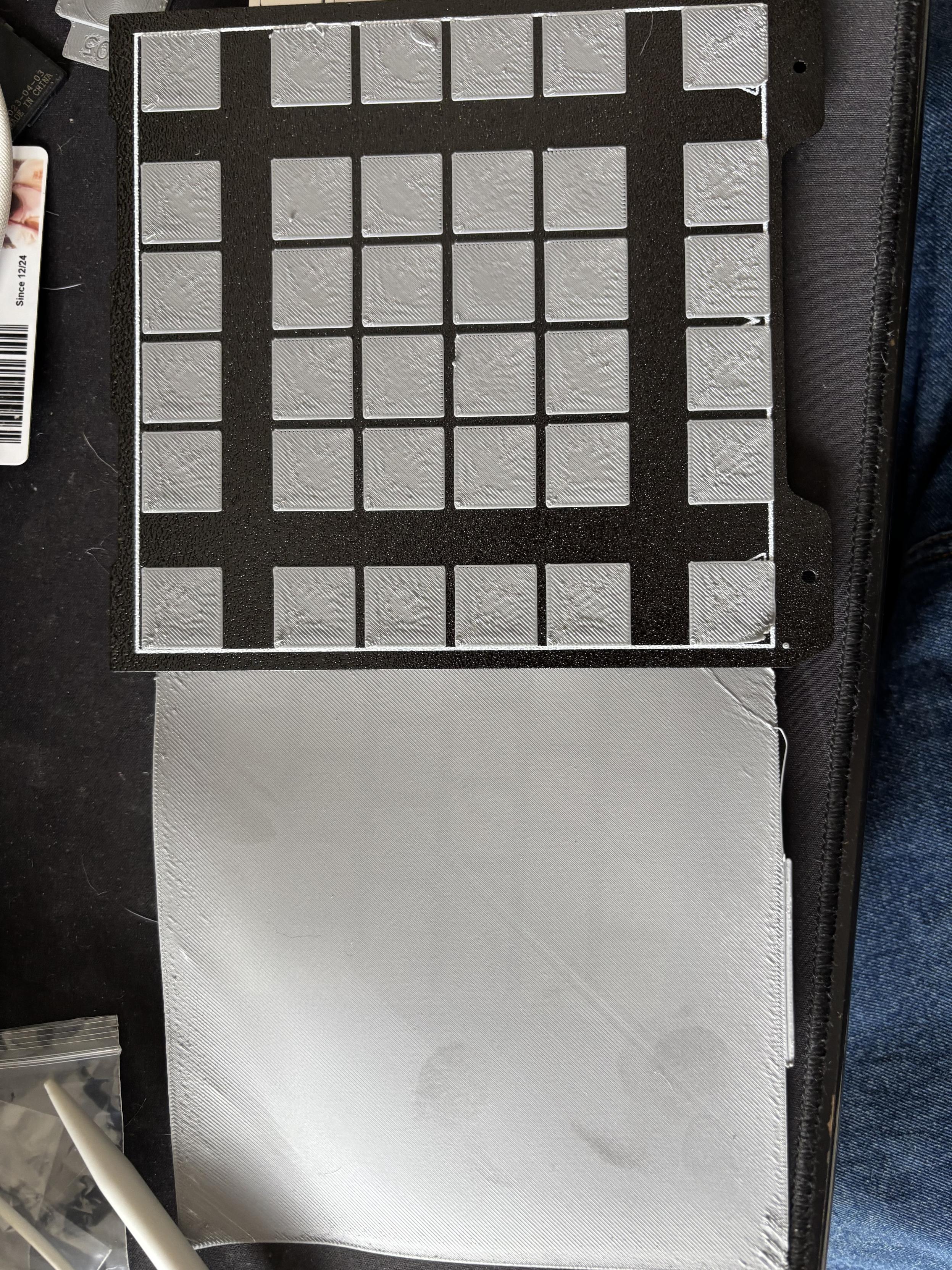 First layer comparisons. Over a large flat area the extruded material is nicely deposited in the main parts but the edges are rough with what seems like over extrusion. On the smaller squares this problem is shown to not just be localised to the bed edges, but is something to do with the printing process. I am not sure if it’s pressure advance that’s playing up or what!