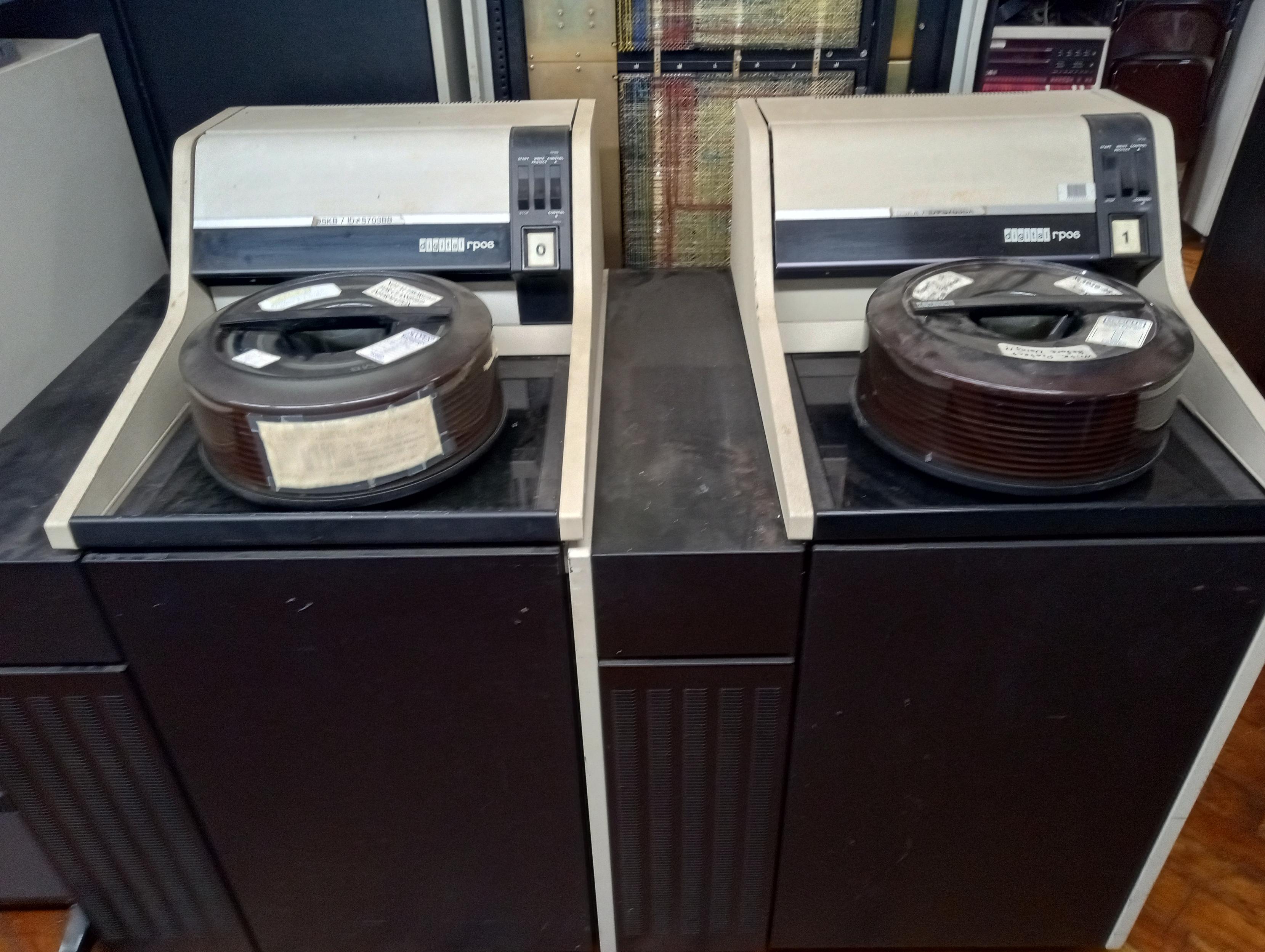 Two big washing machine style RP06 mainframe disk drives from the 70s.