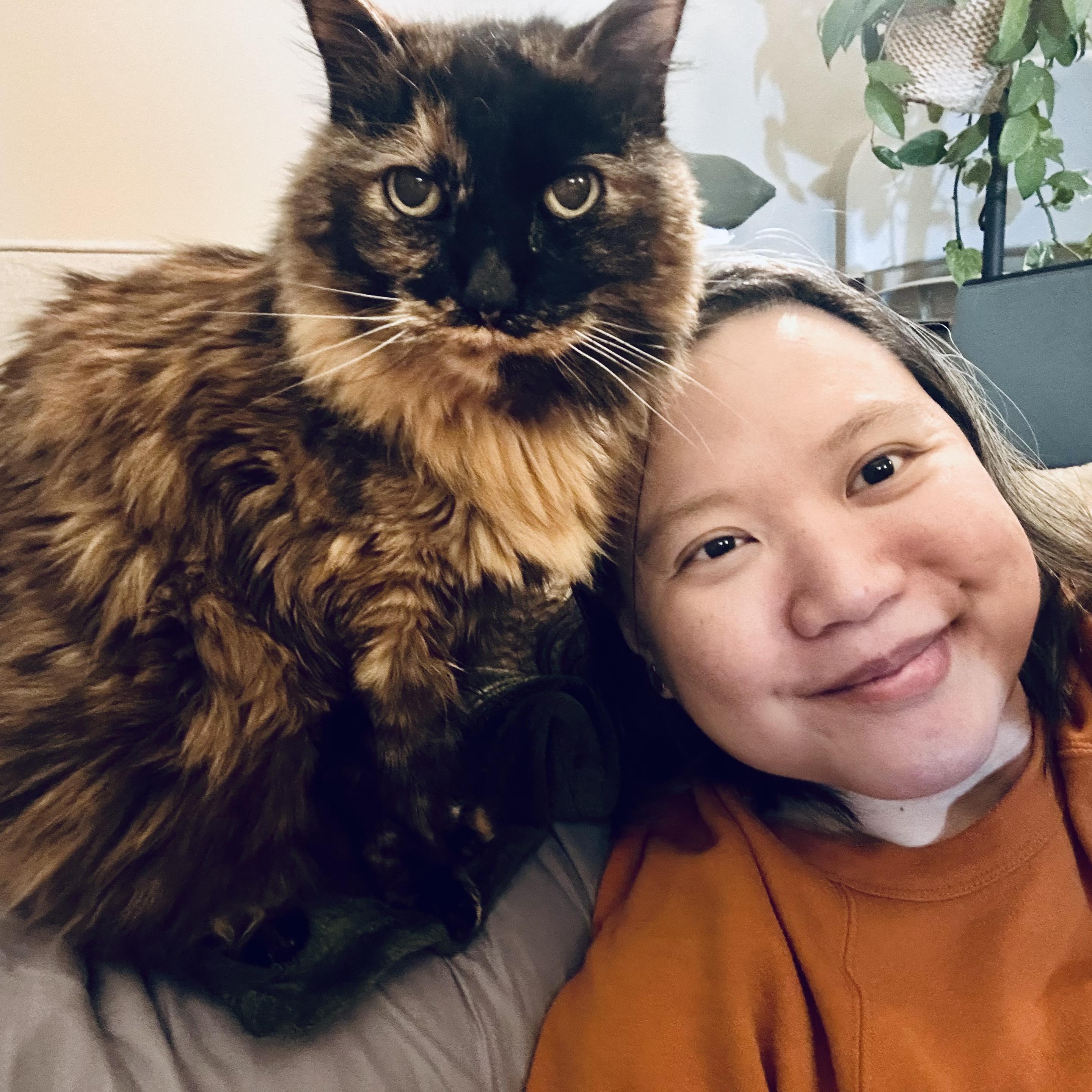 A selfie of me with an elderly long haired tortie
