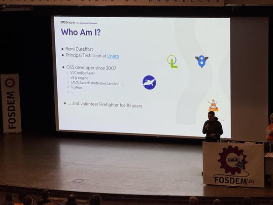 Photo of the Janson stage with a screen showing the first lightning lightning talk. 