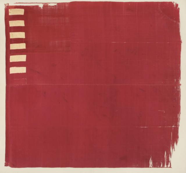A plain red square with six small white rectangles in
the upper-left corner.