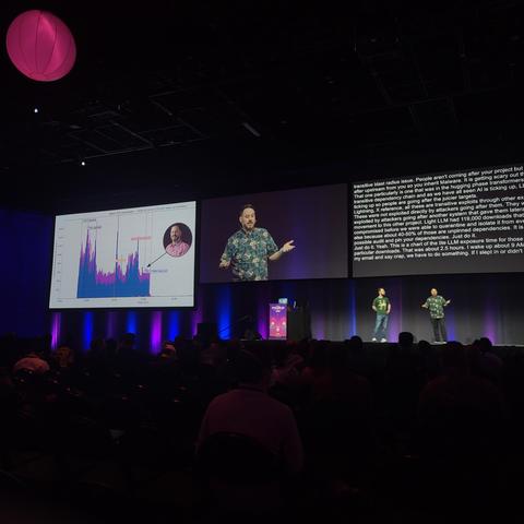 Mike Fiedler giving a talk on stage at PyCon US 2026