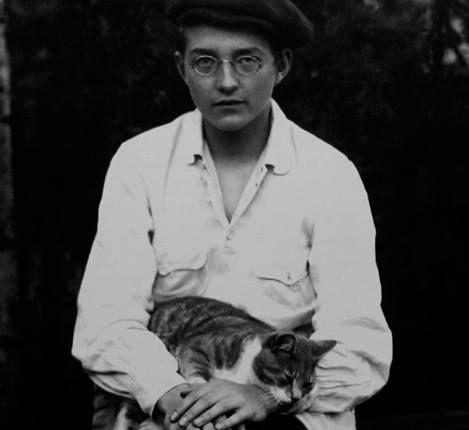 The composer Shostakovich as a boy holding a cat in his lap