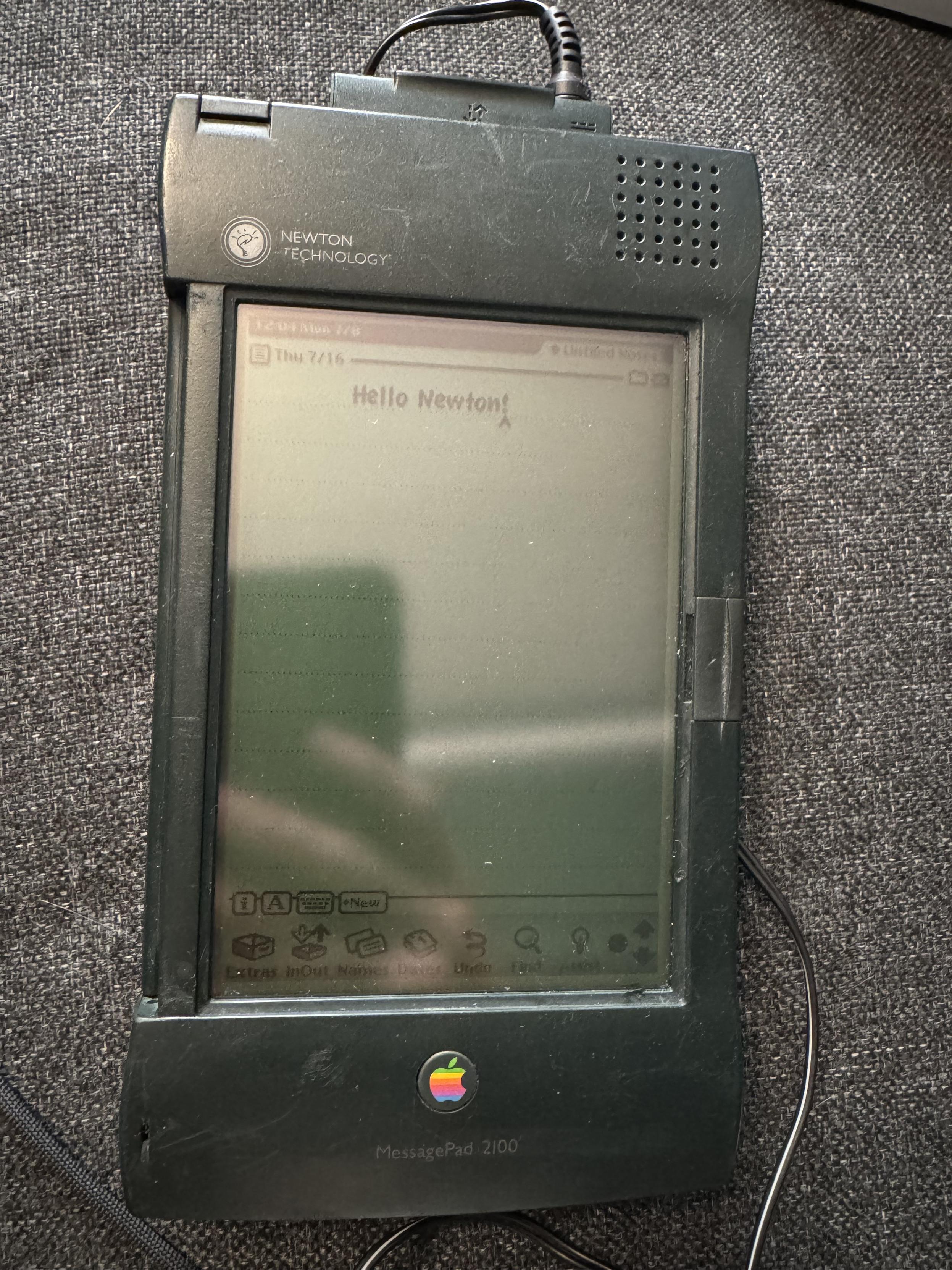 An Apple Newton MessagePad 2100 from 1997. It is open to the notes app (the default homescreen), which is showing “Hello Newton!”